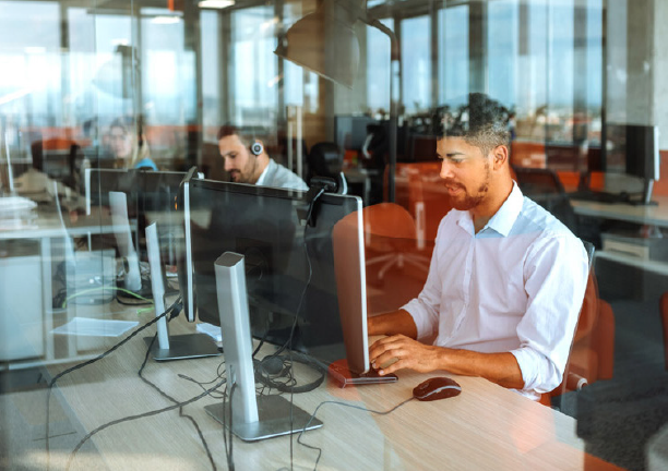 Man on computer at desk