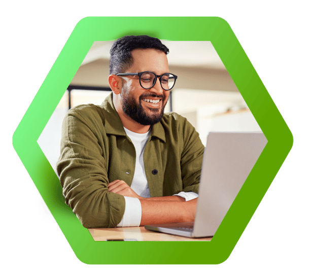 Happy man looking at laptop