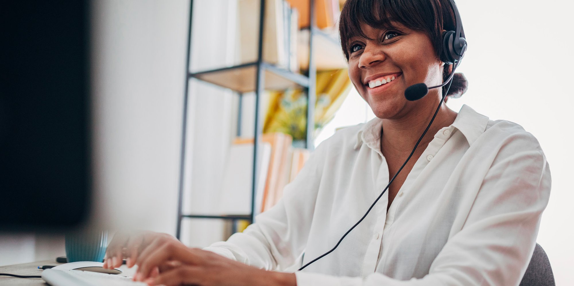 Tech woman on the phone smiling
