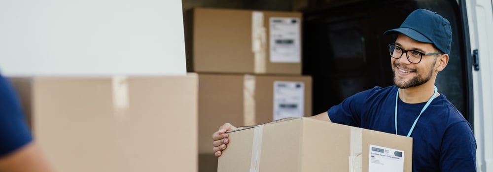 Man unloading boxes from a truck Man unloading boxes from a truck