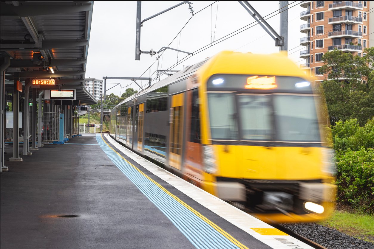 electric train line on tracks with wires overhead