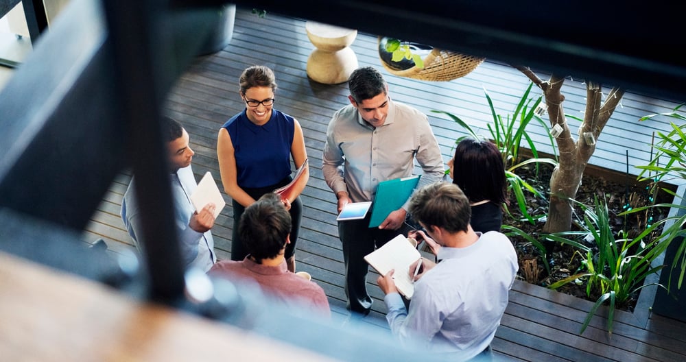 top view of employees gathering for a discussion